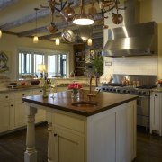 View of an open-plan kitchen featuring a central countertop, cuisine classique, interior design, kitchen, room, brown