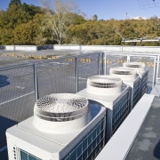 View of air conditioning and ventilation system at architecture, roof, water, white