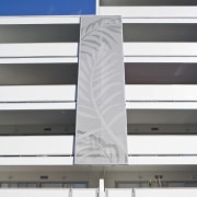 Exterior view of the Ivory apartments which features architecture, building, daylighting, facade, line, structure, white