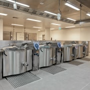 View of large Hackman kettles supplied by Regethermic. floor, product, gray