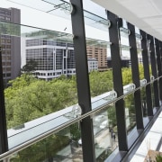 Interior view of the Lucient Apartments which features building, glass, real estate, window, gray