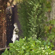 View of a sculpture in the Italian-styled grotto. flora, garden, grass, leaf, plant, shrub, tree, vegetation, green, brown