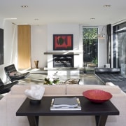 View of living room which features a day house, interior design, living room, real estate, table, gray