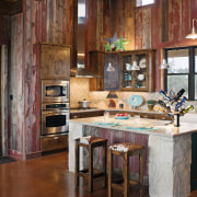 View of a farmhouse styled kitchen which features cabinetry, countertop, home, interior design, kitchen, real estate, room, table, wood, brown