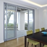 View of the dining area at the Harbourcity architecture, ceiling, daylighting, door, floor, flooring, hardwood, house, interior design, real estate, table, window, wood, wood flooring, gray