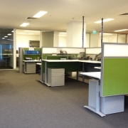 View of an office area within the MCC desk, floor, flooring, furniture, interior design, office, product, orange