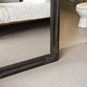 View of a bedroom area which features pure carpet, floor, flooring, furniture, tile, wood, gray