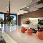 Interior view of the kitchen area at a architecture, house, interior design, real estate, orange