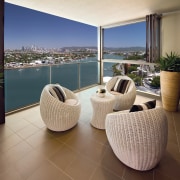 View of Hamilton Harbour apartment patio area with estate, floor, flooring, furniture, home, interior design, living room, property, real estate, table, brown, gray