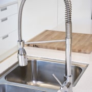 View of the kitchen basin with movable tapware. bathroom sink, plumbing fixture, product design, sink, tap, white