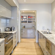 View of the kitchen at the Harbourcity developed countertop, interior design, kitchen, real estate, room, gray