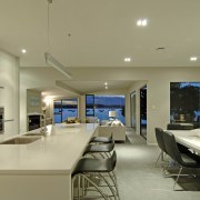 Interior view of an open-plan living area including ceiling, interior design, real estate, orange, brown