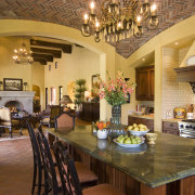 View of the kitchen area which features a countertop, dining room, home, interior design, kitchen, living room, real estate, room, brown, orange