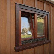 View of windows with wooden frames from Heirloom home, window, wood, wood stain, brown