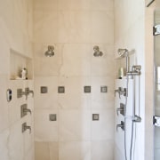 View of shower enclosure which features a variety bathroom, floor, flooring, interior design, plumbing fixture, room, shower, tap, tile, wall, gray