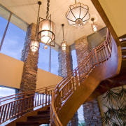 View of stairway which features chandelier hanging overhead architecture, lighting, tourist attraction, wood, orange