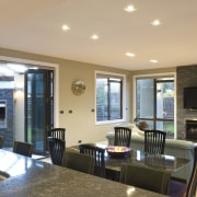 View of open-plan kitchen and dining area which ceiling, flooring, home, interior design, living room, real estate, room, orange