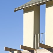 Exterior view of a high-end home with a architecture, building, column, facade, house, sky, structure, window, teal