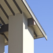 Exterior view of a high-end home with a architecture, daylighting, facade, house, roof, siding, sky, structure, teal