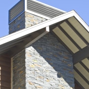 Exterior view of a high-end home with a architecture, brick, brickwork, building, commercial building, daylighting, facade, roof, siding, structure