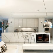 View of a modern kitchen which features a interior design, living room, real estate, white