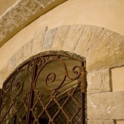 View of a wine cellar which features limestone ancient history, arch, carving, history, wall, orange