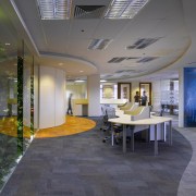 View of office workstations which feature curved desks, architecture, ceiling, daylighting, floor, flooring, interior design, lobby, real estate, gray