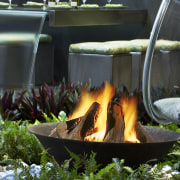 View of a landscaped garden which features three backyard, grass, leaf, plant, water, water feature, black, green