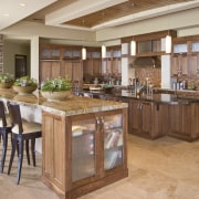 View of the kitchen area of this home cabinetry, countertop, cuisine classique, floor, flooring, hardwood, interior design, kitchen, table, wood flooring, brown, orange