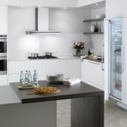 A view of this kitchen featuring the new cabinetry, countertop, cuisine classique, home appliance, interior design, kitchen, kitchen appliance, kitchen stove, small appliance, white, gray