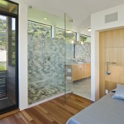 View of the master bedroom with wooden flooring, architecture, door, home, house, interior design, property, real estate, room, wall, window, gray