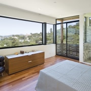 View of the master bedroom with wooden flooring, architecture, door, estate, floor, home, house, interior design, property, real estate, window, white