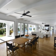 View of the main living area which features ceiling, daylighting, dining room, floor, house, interior design, living room, property, real estate, window, gray