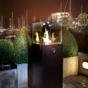 view of the freestanding outdoor flare; Illuminate available lighting, night, reflection, red, black, brown