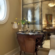 View of a powder room which features a bathroom, ceiling, furniture, home, interior design, room, table, brown