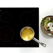 View of ceramic cooktops from Fisher &amp; Paykel. cookware and bakeware, product design, tableware, white, black