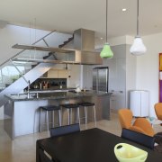 View of a small kitchen beneath a stairway architecture, countertop, house, interior design, kitchen, living room, loft, real estate, gray