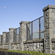 View of the stone wall with metal sections ancient history, archaeological site, bridge, building, column, structure, teal, gray