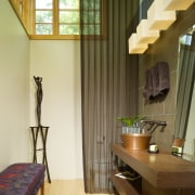 View of a small powder room which features architecture, ceiling, curtain, floor, flooring, furniture, hardwood, home, house, interior design, living room, real estate, room, table, wall, window, window covering, window treatment, wood, brown, yellow