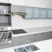 view of a kitchen which features Oliveri's new countertop, kitchen, kitchen stove, product, product design, white, gray