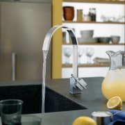 View of a kitchen which features faucets from countertop, glass, interior design, kitchen, product design, table, tap, yellow, gray