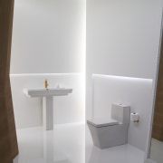 View of a Kohler basin with gold faucets bathroom, bathroom accessory, bathroom cabinet, bathroom sink, ceramic, floor, plumbing fixture, product design, room, shelf, sink, tap, toilet seat, wall, gray