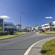 external view of inteplex@albany developed by northbridge properties. area, asphalt, car, city, daytime, downtown, house, infrastructure, lane, metropolitan area, neighbourhood, real estate, residential area, road, sky, street light, suburb, town, tree, urban area, teal