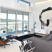 interior view of an apartment living room featuring furniture, home, interior design, living room, room, table, window, white