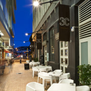 view of chews lane development,featuring pathed pathways,lighting,doors and restaurant, black
