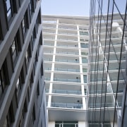 external view of apartment tower above a landscaped apartment, architecture, building, condominium, daylighting, facade, glass, handrail, house, line, stairs, structure, window, gray, black