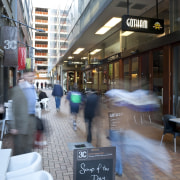 view of chews lane development,featuring pathed pathways,lighting,doors and building, gray