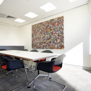 View of the boardroom which features carpeted flooring, conference hall, desk, furniture, interior design, office, product design, real estate, table, white