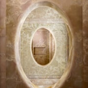 View of the pink onyx panels which feature circle, texture, orange, brown