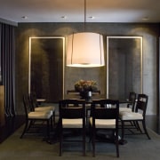 This remodel of a Victorian residence has retained ceiling, dining room, furniture, interior design, light fixture, lighting, living room, room, table, wall, black